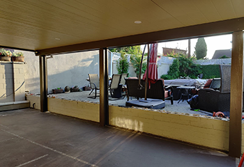 Modern patio cover installation with recessed lighting in Temple City backyard
